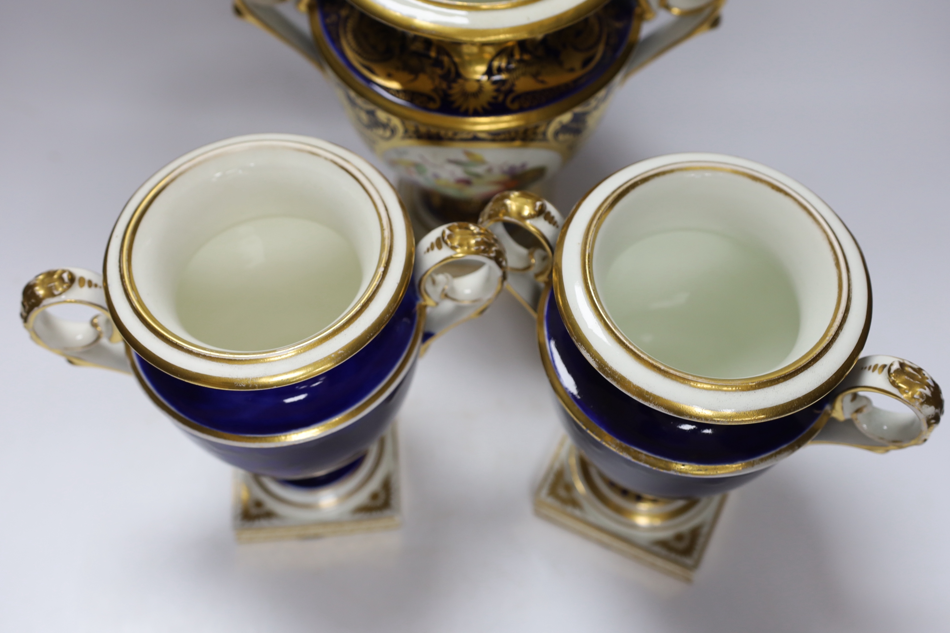 A garniture of three early 19th century Derby vases painted with fruit, tallest 23cm